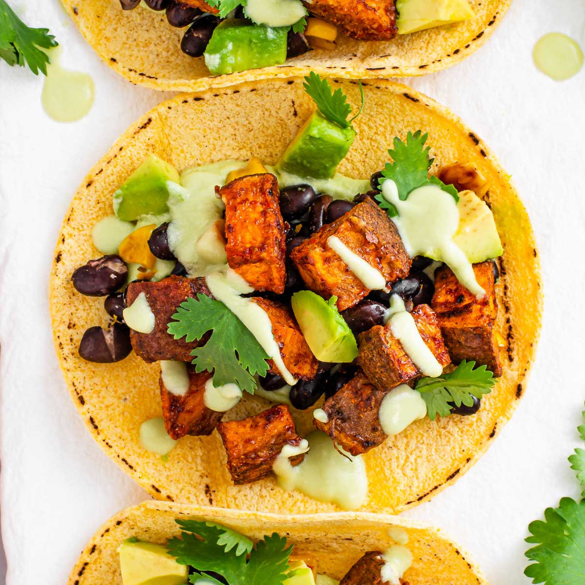 Mexican Black Bean and Sweet Potato Tacos with Avocado Crema